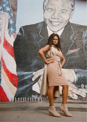 Raquel Willis wearing Joan Uptown Chelsea wedges in an urban setting