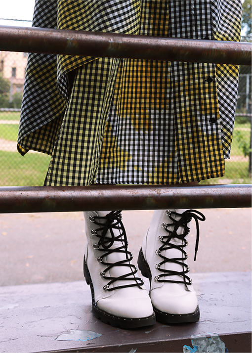 Marjon Carlos wearing Lennox Lace booties in an urban setting