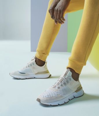 A close-up image of man wearing Kinetic Rush sneakers