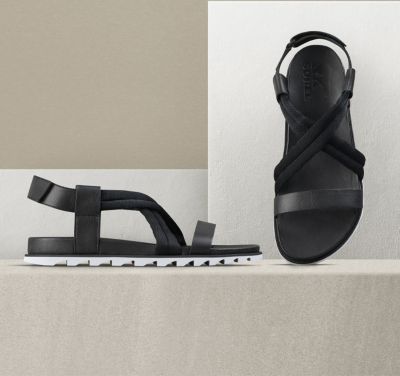 A pair of Roaming Decon sandals on a beige background