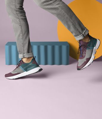 A close-up image of man wearing Kinetic Rush sneakers