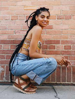 Monique Jones wearing Roaming Multi Strap sandals