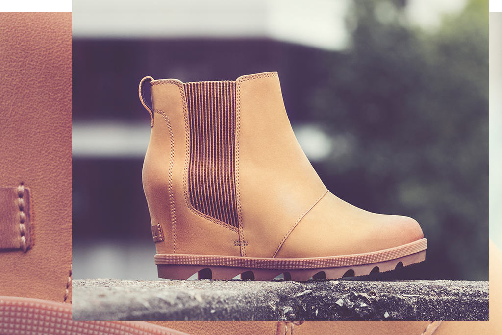 A close up of  Joan Wedge Chelsea boot in an urban environment 