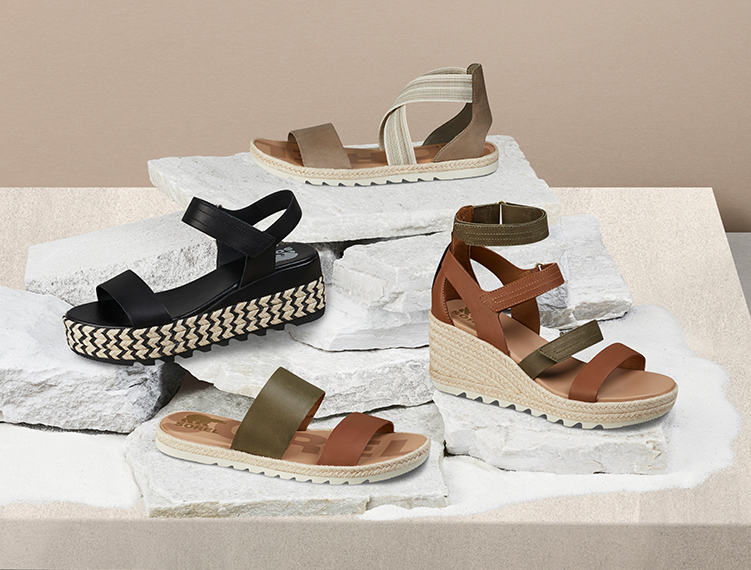 A collection shot of espadrille sandals sitting on a table