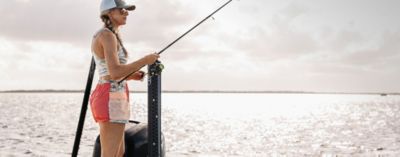 Woman fishing in gear from the Nicole Combs Collection.