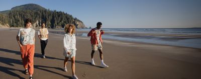 SEA OF STYLE over an image of friends exploring the Oregon coast.