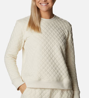 Woman in a white quilted crew neck sweatshirt