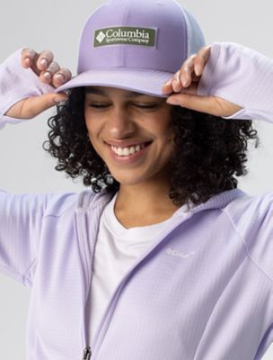 A woman in a Columbia hat. 