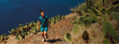 A hiker exploring a sunny landscape with the text: Looking For More?