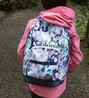 A girl wearing a backpack. 