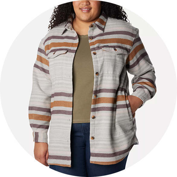 Woman in a plus size shirt jacket for fall.