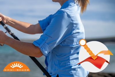 Model in profile casting a line in the blue Tamiami button up shirt. Omni-Shade logo is on the bottom left and a graphic showing how the sun's rays are blocked by fabric is on the bottom right.