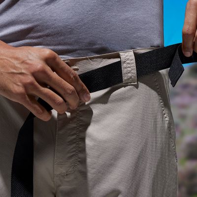 Model either taking off or putting on the included belt.
