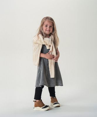 Little girl wearing Sorel shoes