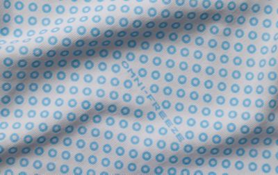  A close-up of Columbia’s Omni-Freeze Zero highlights its small blue circles, showcasing the visible cooling technology.