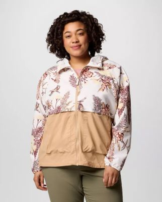 A woman wearing a floral print rain jacket.