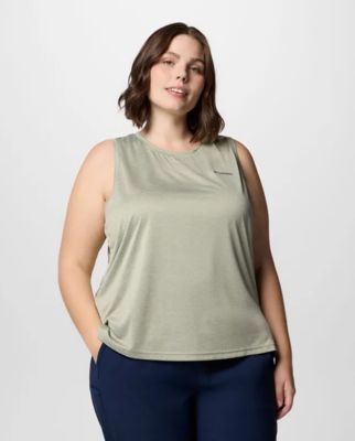 A woman wearing a green tank top.