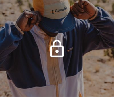 Hiker adjusting their cap with a lock icon over the top.