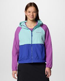 A woman wearing a multi-color jacket.