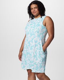 A woman wearing a multi-color dress.