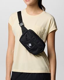 A person wearing a black hip pack as a crossbody.