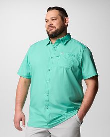 A man wearing a teal button-up shirt.