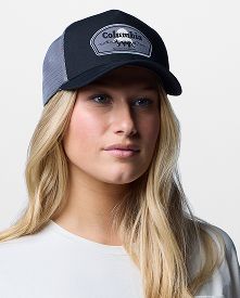 A woman wearing a ball cap.