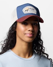 A woman wearing a ball cap.