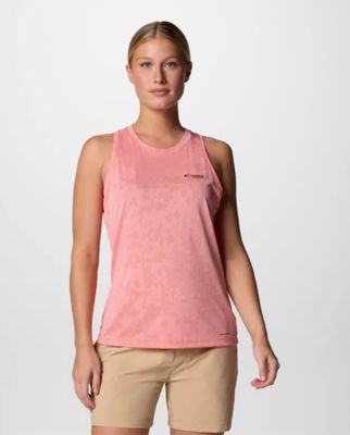 A woman wearing a pink tank top.