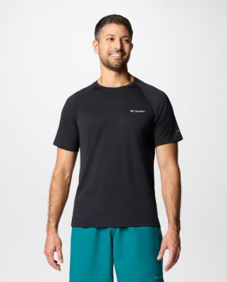 Man wearing a navy short-sleeve shirt.