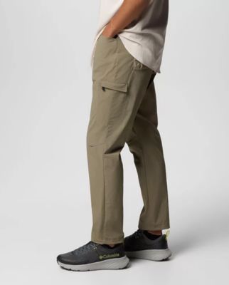 Waist-down image of a man wearing green pants.