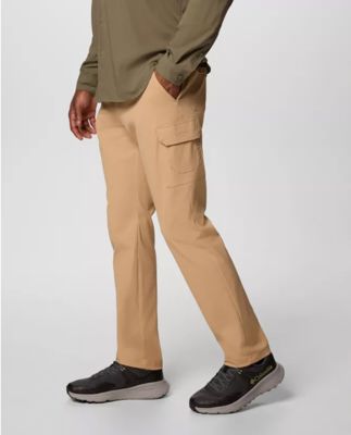 Waist-down image of a man wearing tan utility pants.