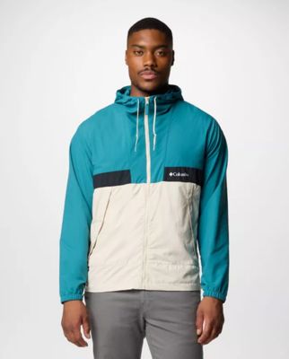 A man wearing a blue and white windbreaker.