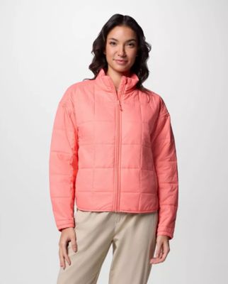 Woman wearing a pink insulated jacket.