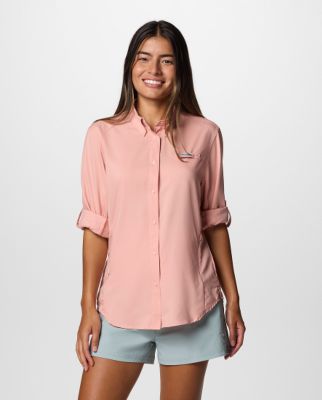 Woman wearing a pink button-up shirt.