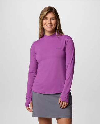 Woman wearing a purple long sleeve shirt.