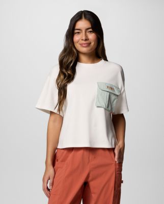 Woman wearing a pink tank top with a graphic on the front.white short sleeve shirt.