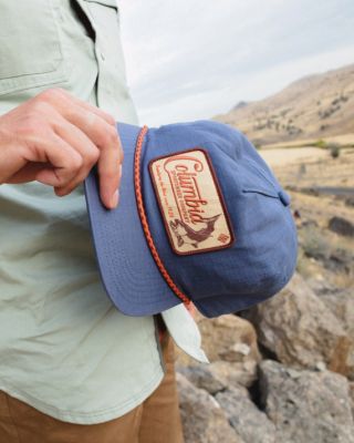 A man holding a hat.