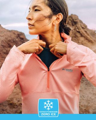 A woman in cooling gear on a trail.