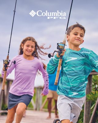 Two kids running with fishing poles.