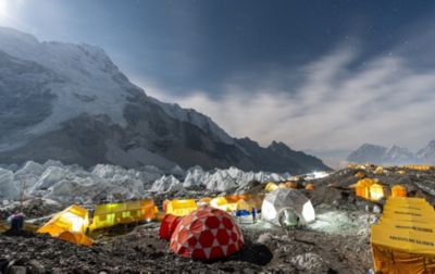 As the sun sets, tents in Base Camp are illuminated by headlamps and lanterns. This was the climbers home for a month. 