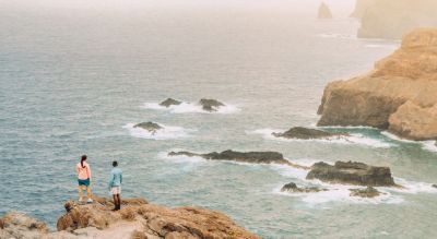 People walking on a beach.