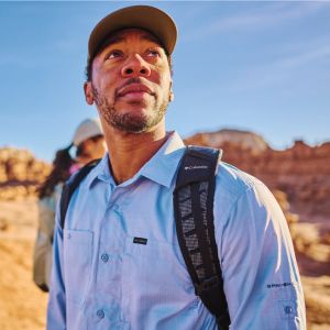 A hiker exploring a sunny trail.