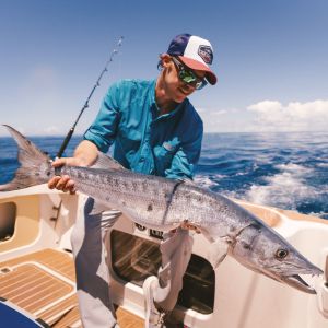 Man with a big fish in his hand.