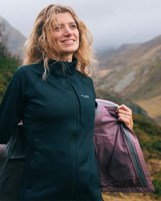 Women wearing a technical fleece during a hike