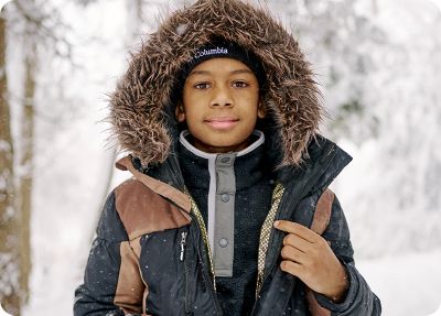 A kid out exploring in bestselling Columbia gear.