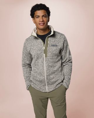 A man smiling wearing a soft, plush fleece.