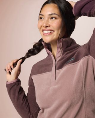 A woman wearing a warm and cozy fleece.