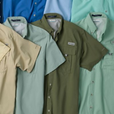 A spread of different colors of short sleeve shirts.