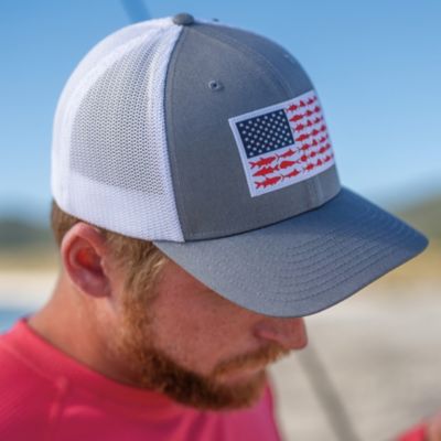 A man in a fish flag hat.